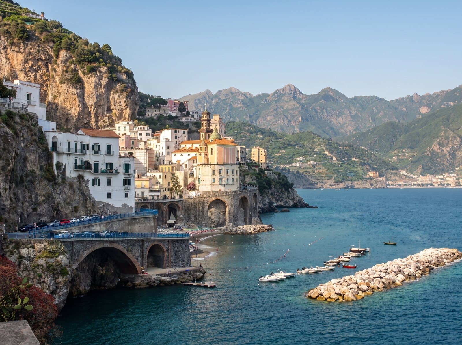 Atrani on the Amalfi Coast, with the arches of the coast road running above the beach