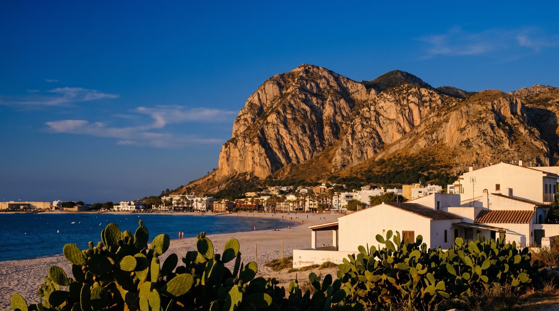 Monte Monaco rising behind San Vito Lo Capo, the limestone headland that closes the bay at the end of the beach