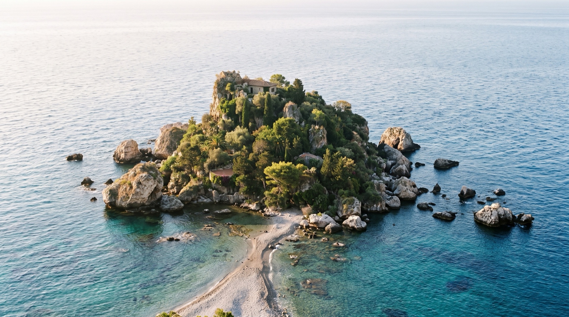Isola Bella bay and its pebble isthmus seen from the coast below Taormina